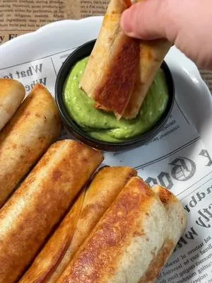 Crispy Cheesy Beef Taquitos with Creamy Avocado Sauce